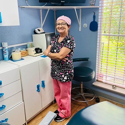 Staff Member Smiling In Operatory