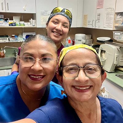Trio Of Staff Members Smiling